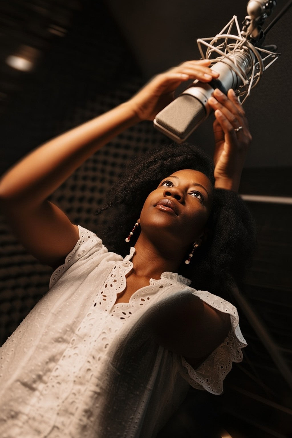 Afrobeats vocalist recording a song in a professional studio